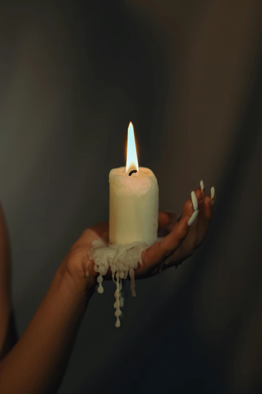 a candle that is glowing in the middle of the night