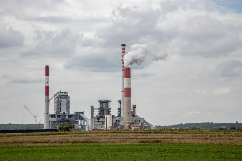 smoke is coming out of chimneys at the power station