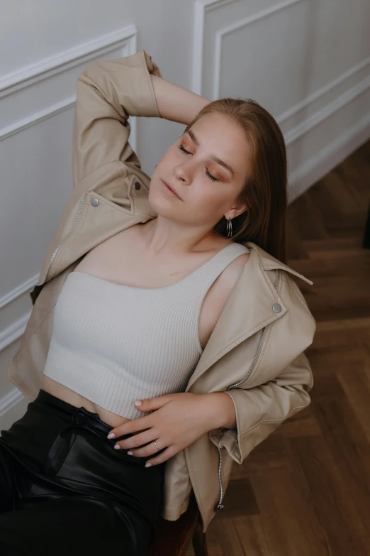 a woman sits on a chair and relaxes