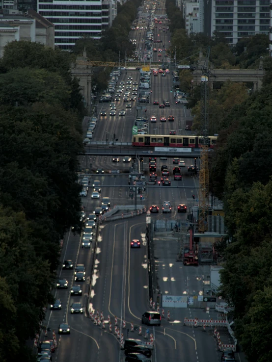 several cars are traveling down a busy city street