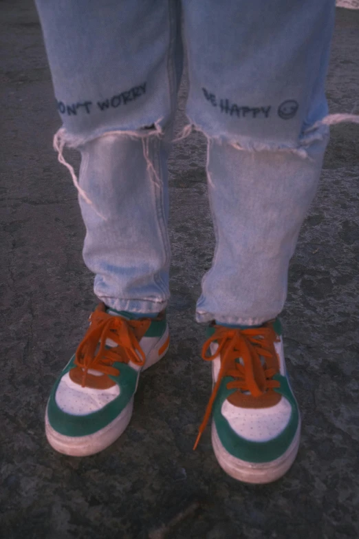 a person's foot with green and red painted on them