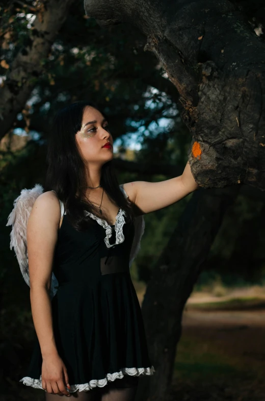 a woman is dressed up in an angel outfit