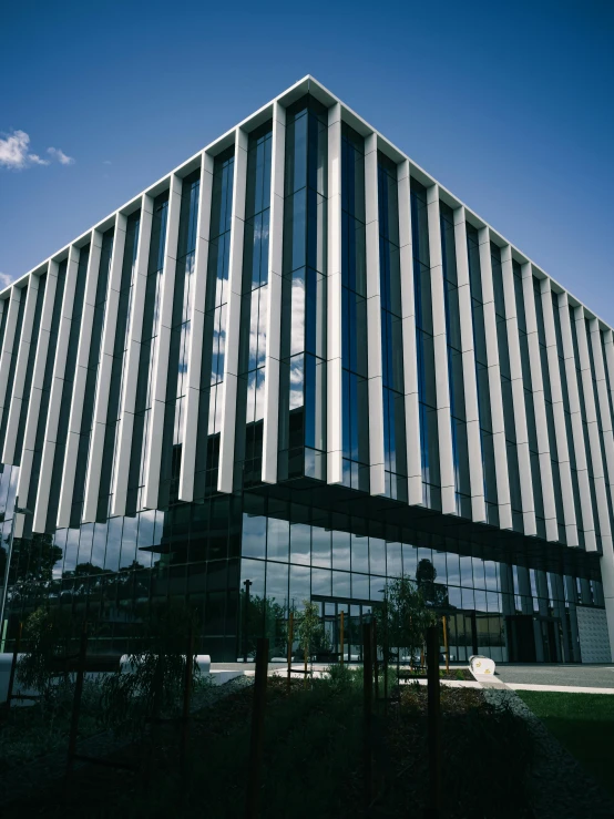 a tall building with black and white stripes on the side