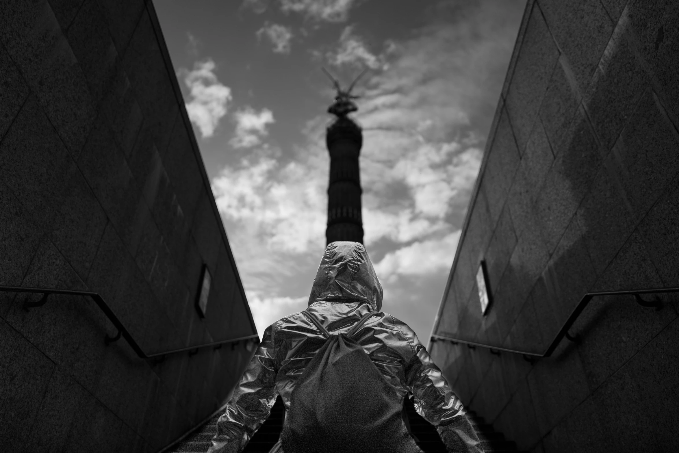 a person in an umbrella is walking along