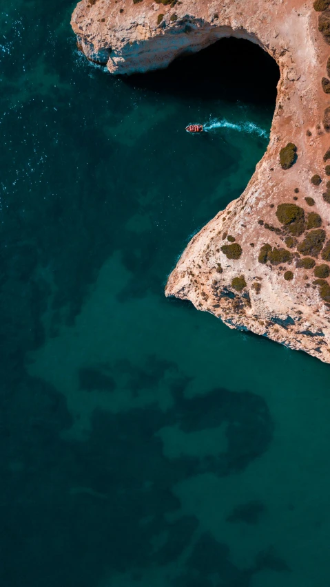 aerial s of two boats traveling through the open water