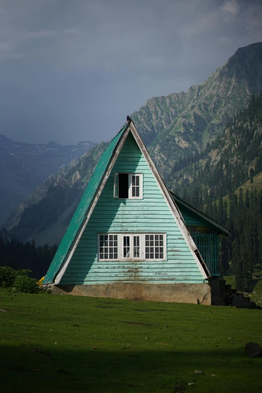 there is a very unusual building in the grass