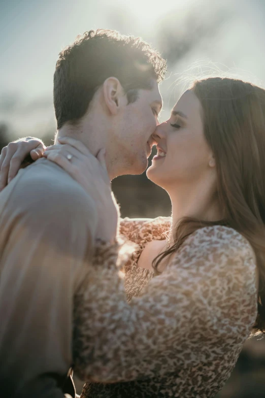 a man kissing the lips of a woman, wearing a leopard print dress