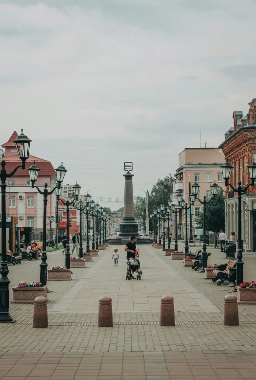 a man and child walking on the street