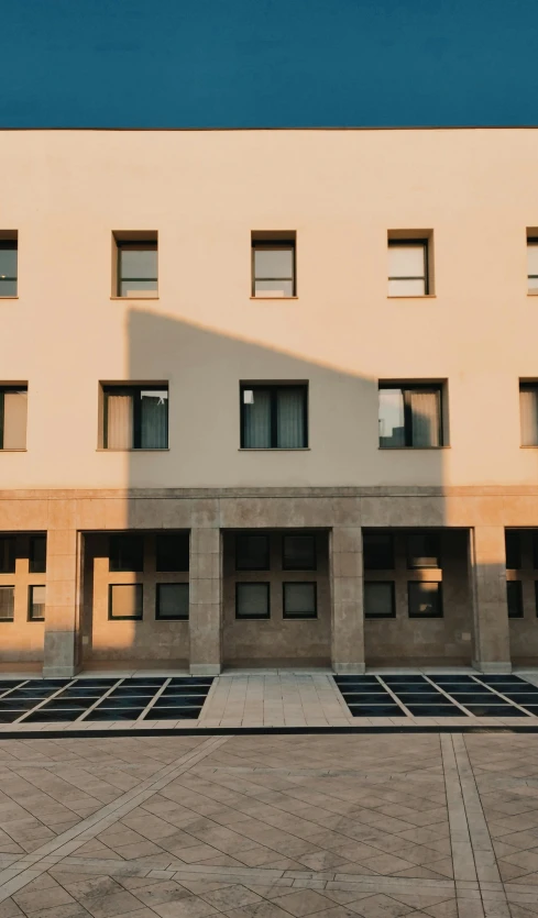 a view of a tall building with lots of windows