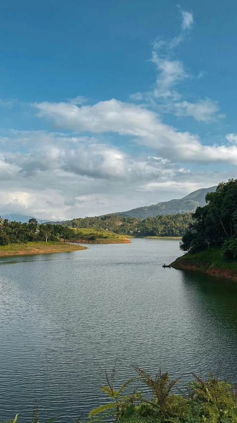 a view of the water with mountains behind it