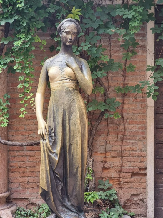 a large statue is standing in front of the building