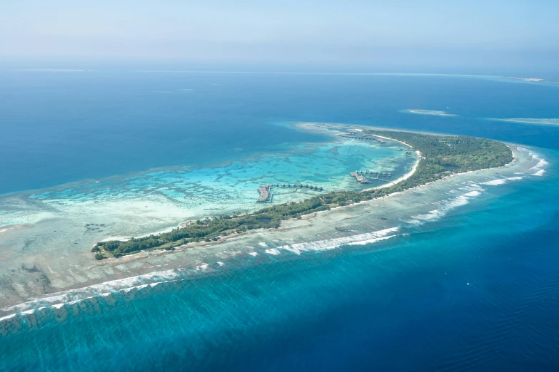 an island in the middle of blue water