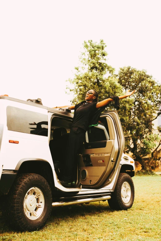 a man in a jeep is holding his baseball bat