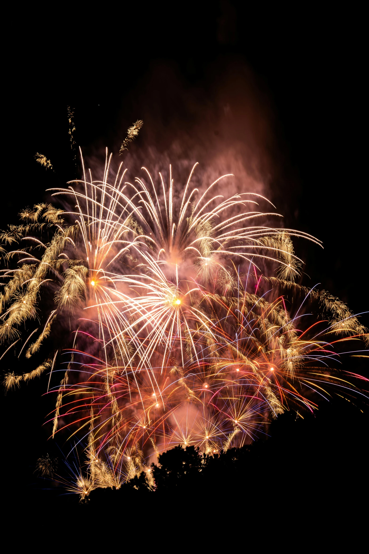 a fireworks display in a large city skyline