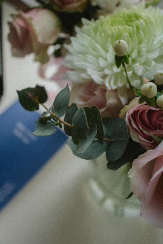 a glass vase with a bunch of flowers in it