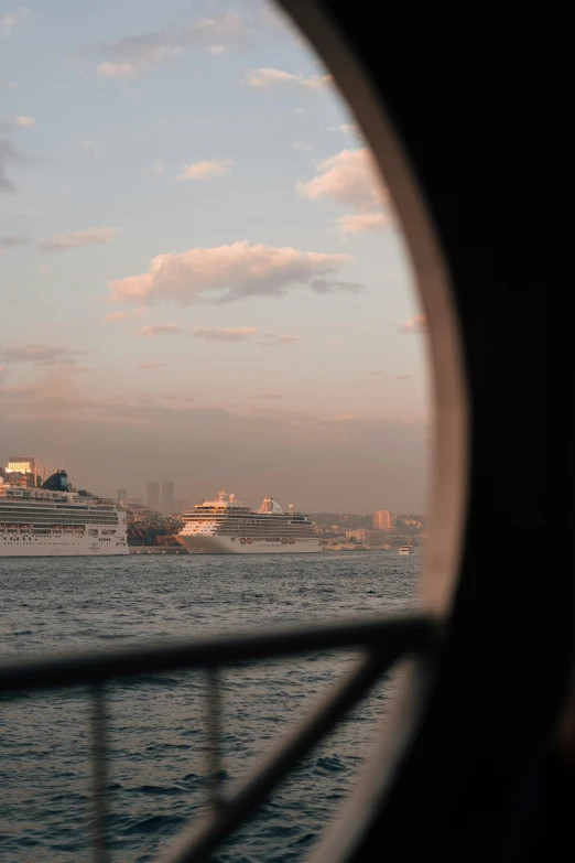 a cruise ship in the distance on water near shore