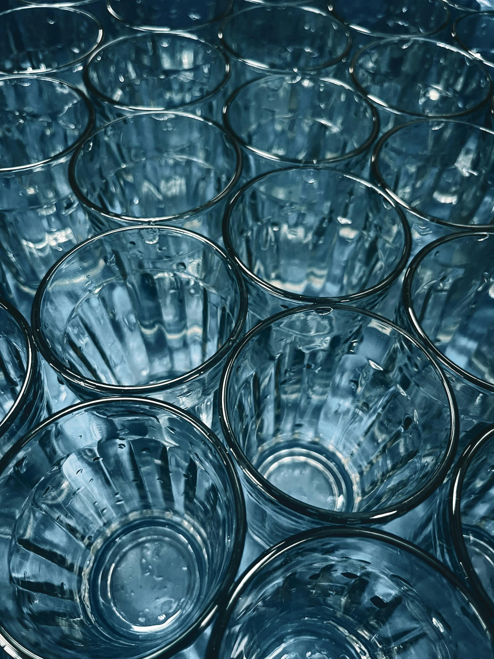 a bunch of empty wine glasses laid on a table