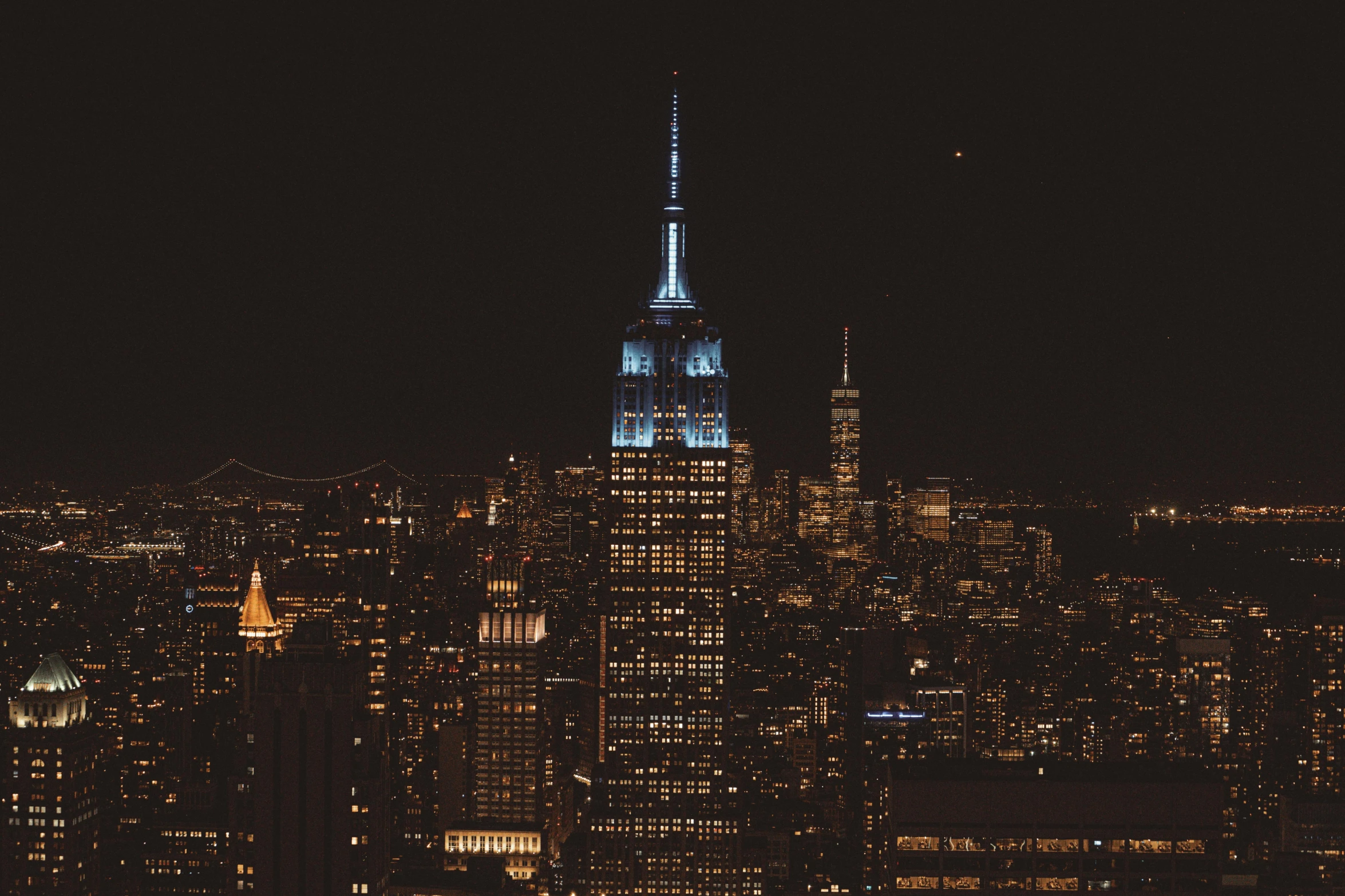 a nighttime view of a city with tall buildings