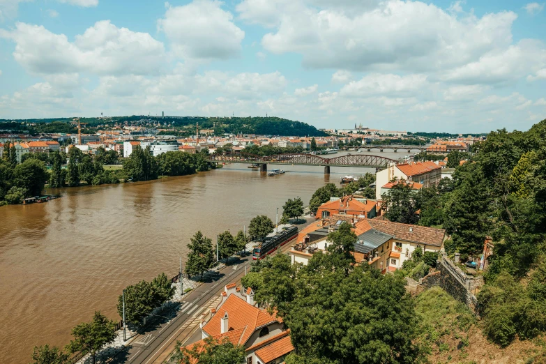 view from above, with buildings in the water and trees near river