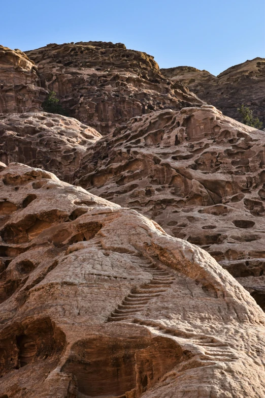 the mountains and valleys have carvings at the tops