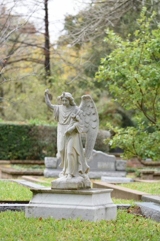 a statue of a person that has wings