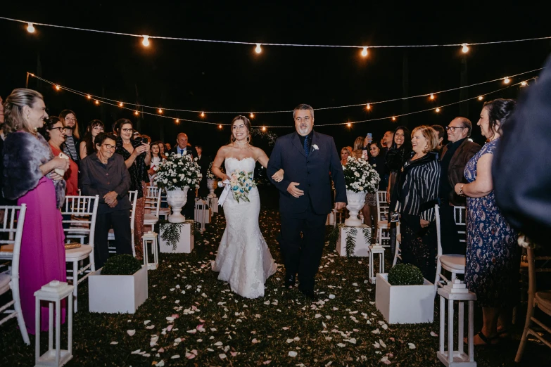 a couple walking back down the aisle after the ceremony