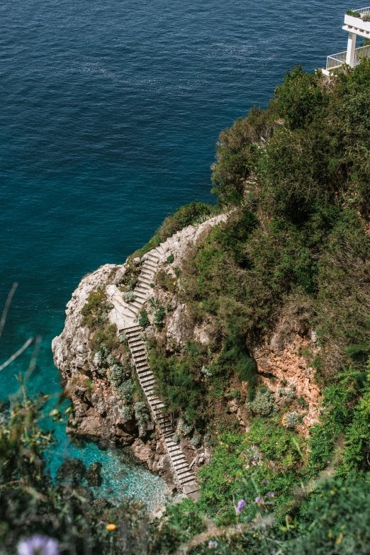 stairs lead down from the water to a beach