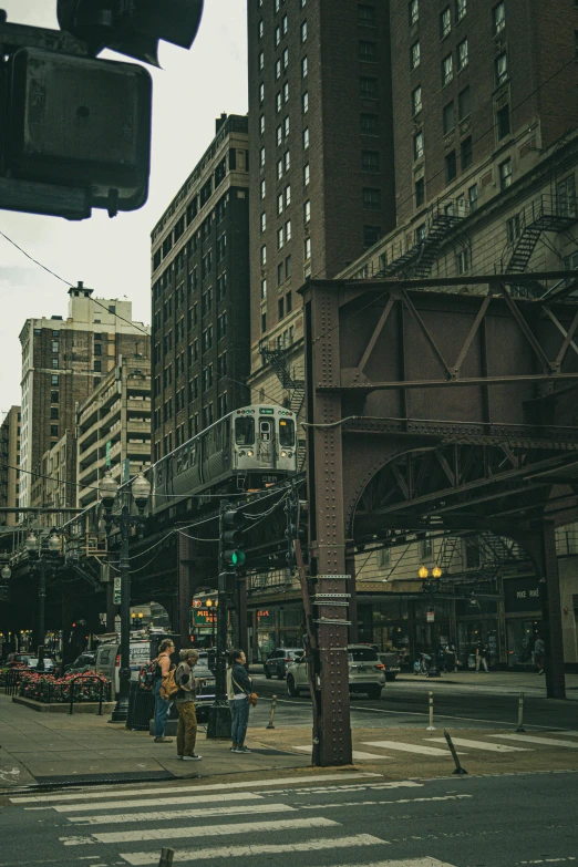 some people on the street near some buildings