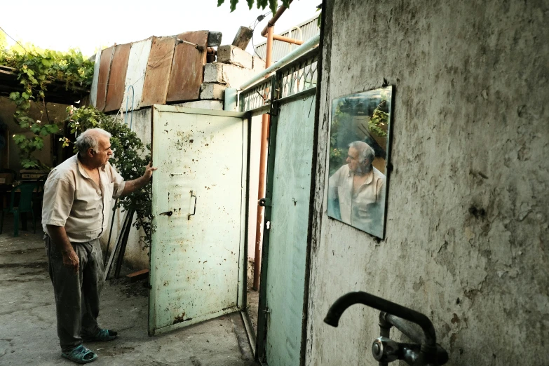 a man opening the door to a tiny house