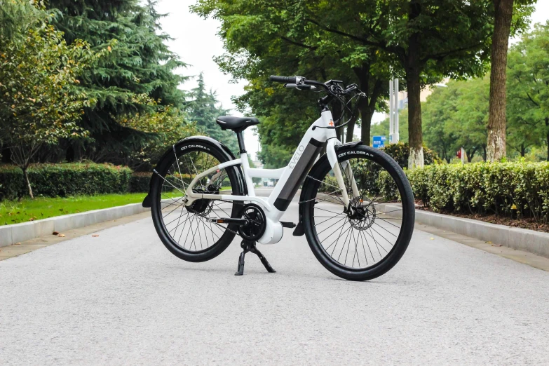 a close up of a bicycle with trees in the background