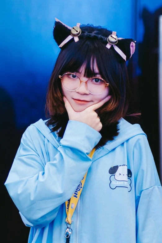 a woman with a cat headband posing for the camera