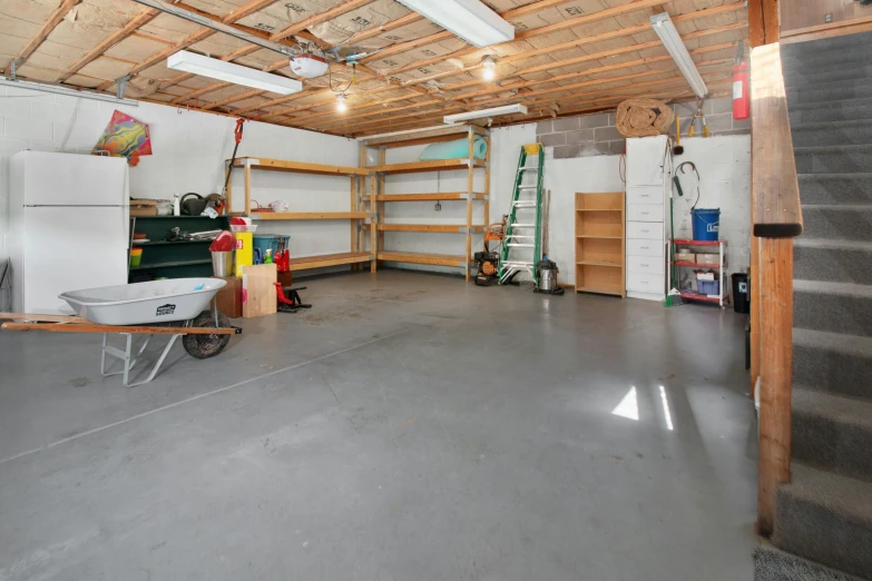 the garage is clean and empty except for cleaning