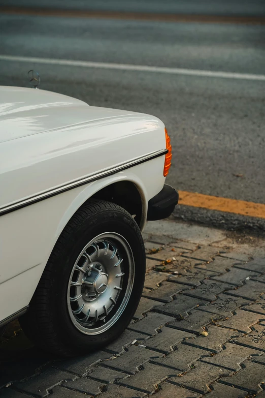 a white truck parked along the side of the street