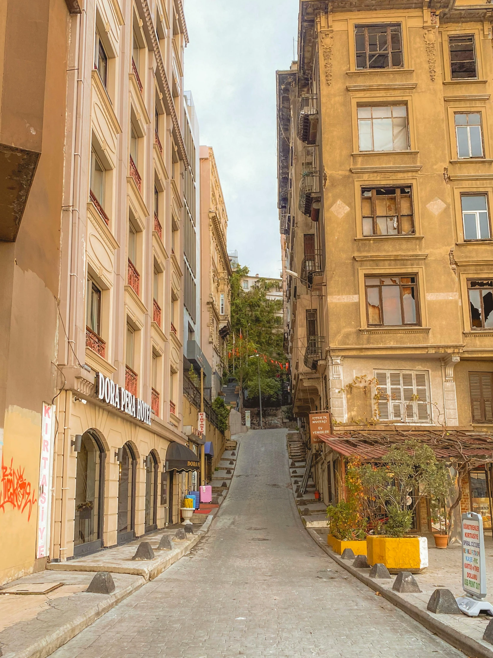 a very narrow city street lined with apartment buildings