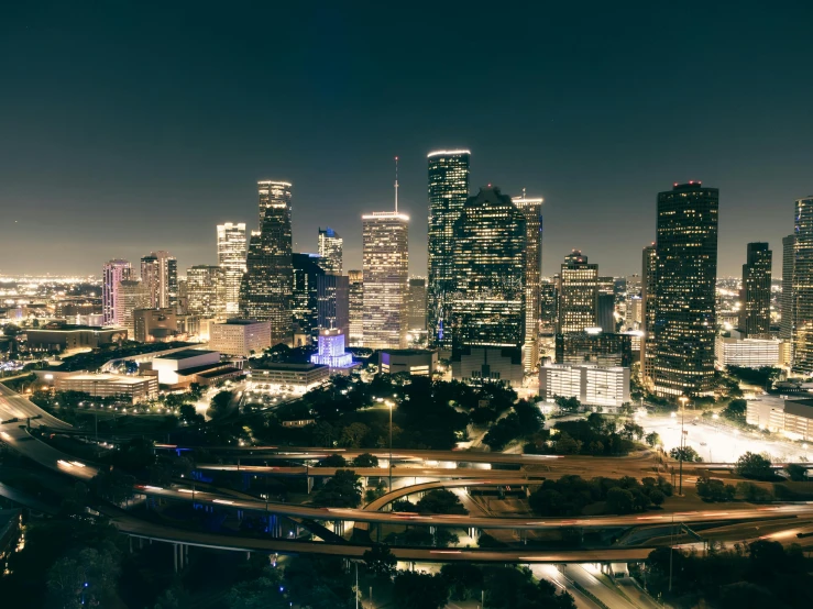 a busy city at night with lots of traffic