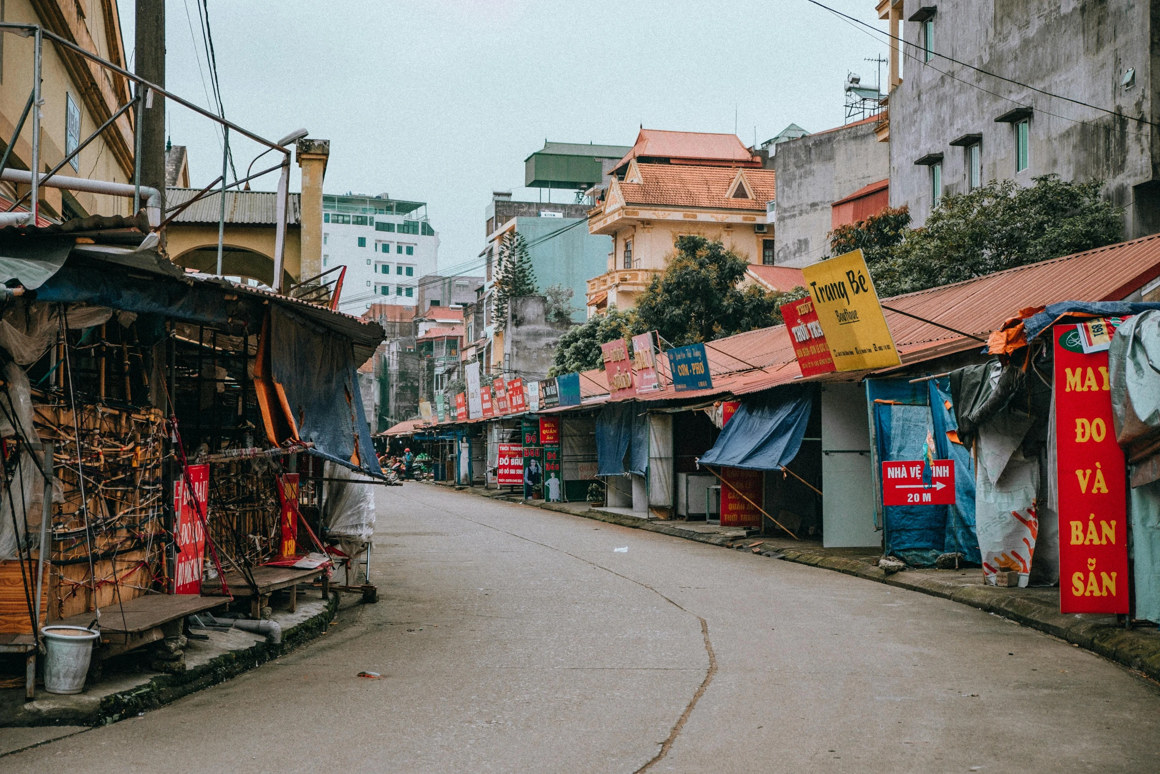 the street view of many shops on either side