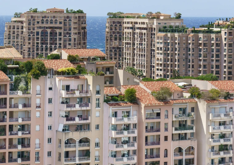 a view of an area of buildings next to the water