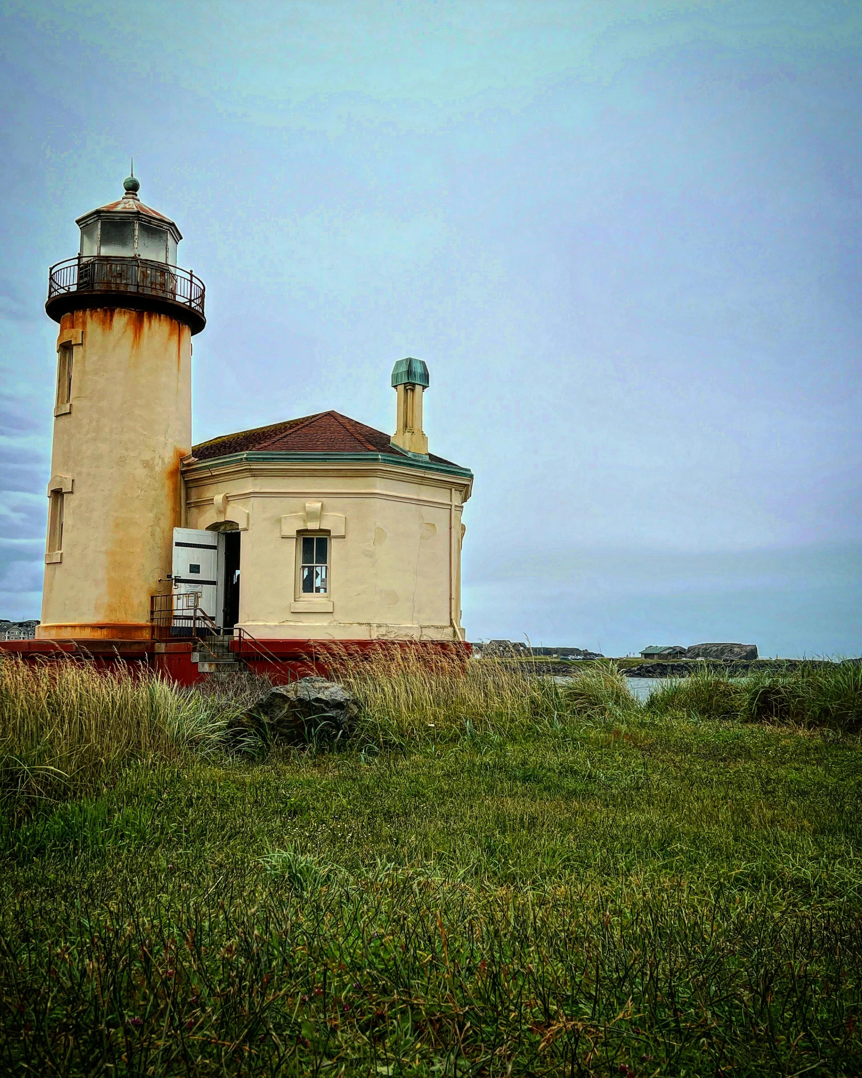 the small light house on the hill has a small light at the top