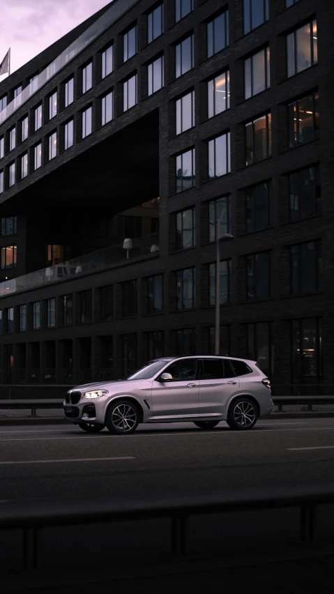 a white car parked in front of a building