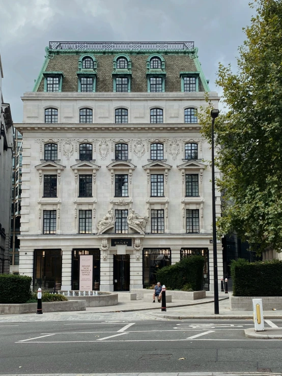 a person in front of a fancy building