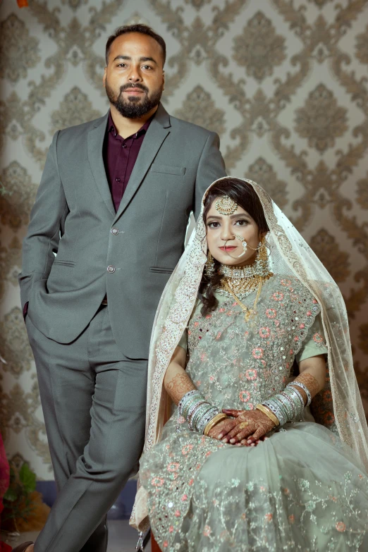 two people dressed up in wedding wear