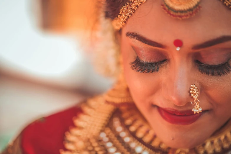 a bride getting ready for her hindu wedding ceremony