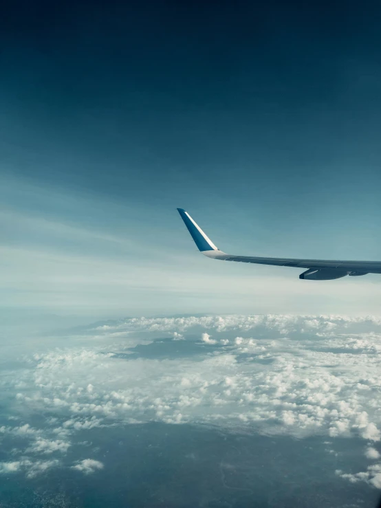 the view from an airplane as it flies over the clouds