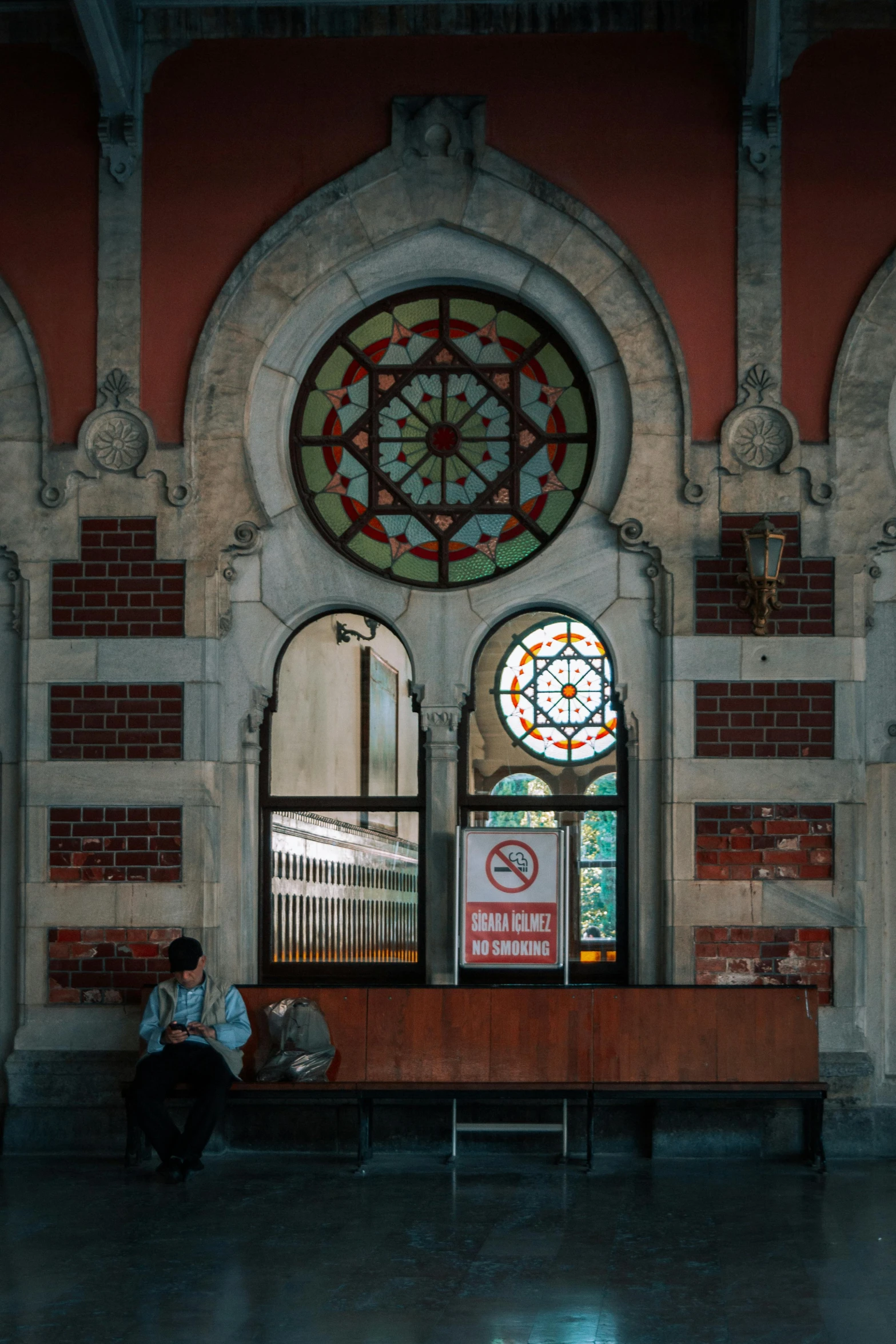 a very tall and large window in an old building