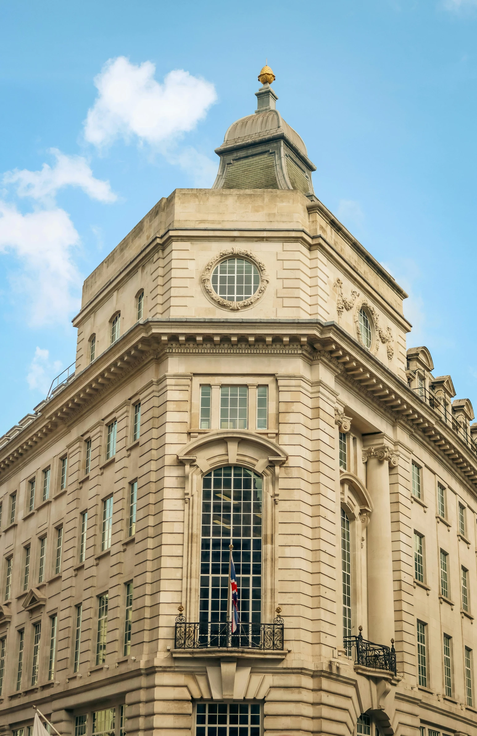 a picture of a building with people looking through a window