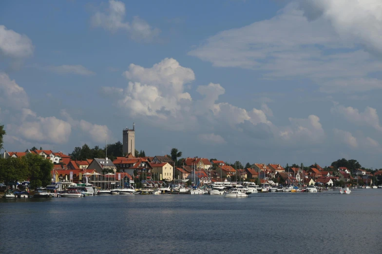 a body of water surrounded by buildings and boats