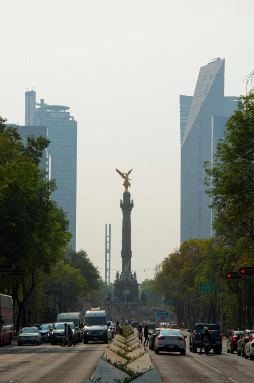 there is an angel statue in the middle of the street