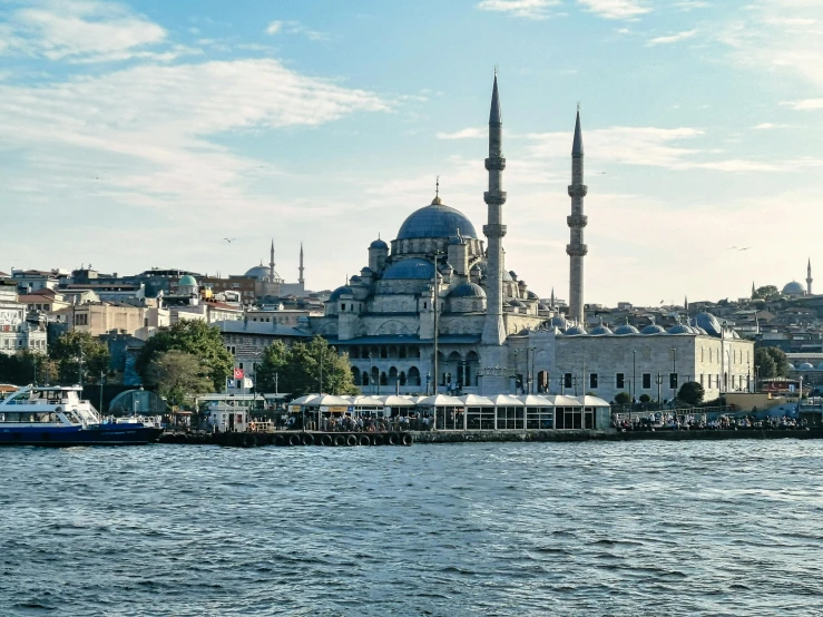 the building that houses a restaurant and shops stands near the water