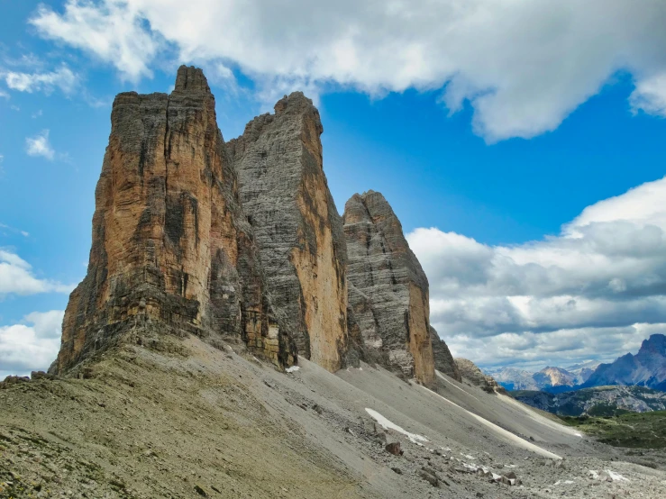 there is a rock formation on the hill that has rocks on it