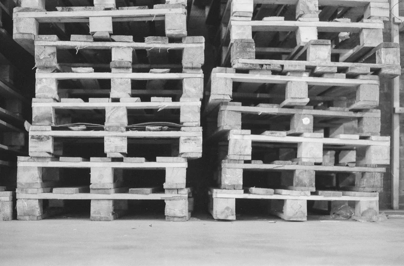 an old black and white pograph of stacked concrete blocks